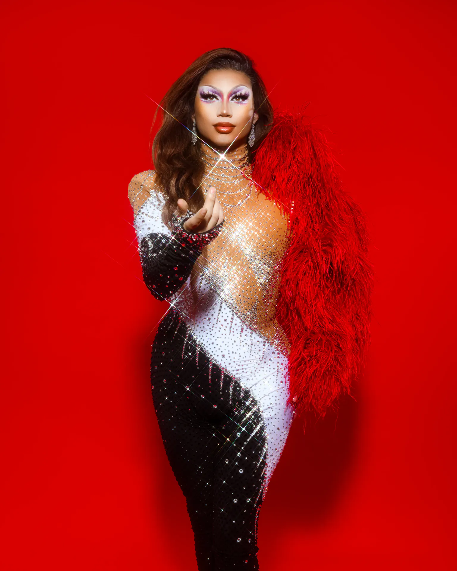 Freya Armani in dramatic red and black drag styling