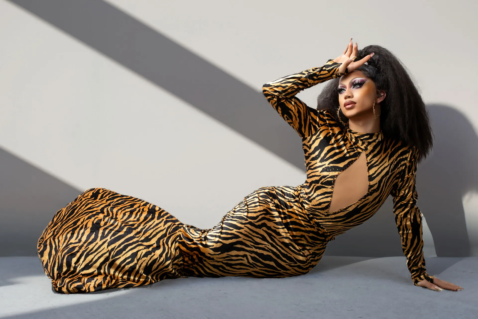 Freya Armani posing in sculpted tiger-print drag fashion