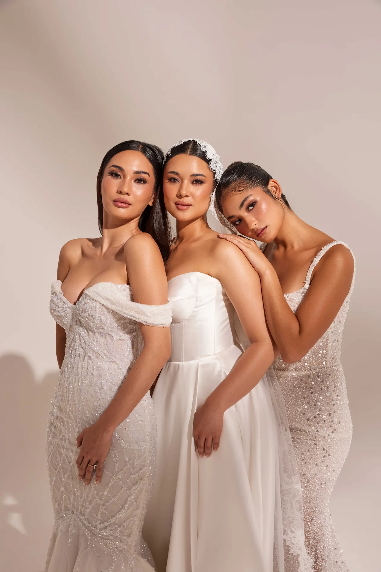 Three brides wearing makeup created by Hong Le